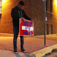 Volunteer Albert Lopez, 18, puts up a Spanish-language voting sign in El Paso, Texas, a predominantly Latinx border town that voted blue this year.